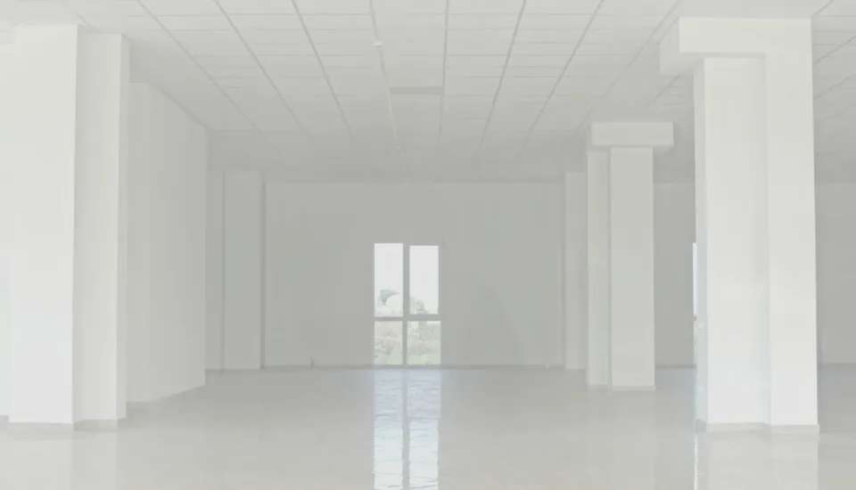 photo highlights finished floors, lights on… but no chairs, no tech, no signage. Visually communicates: “We built the building—but forgot to make it usable. - church building design mistakes