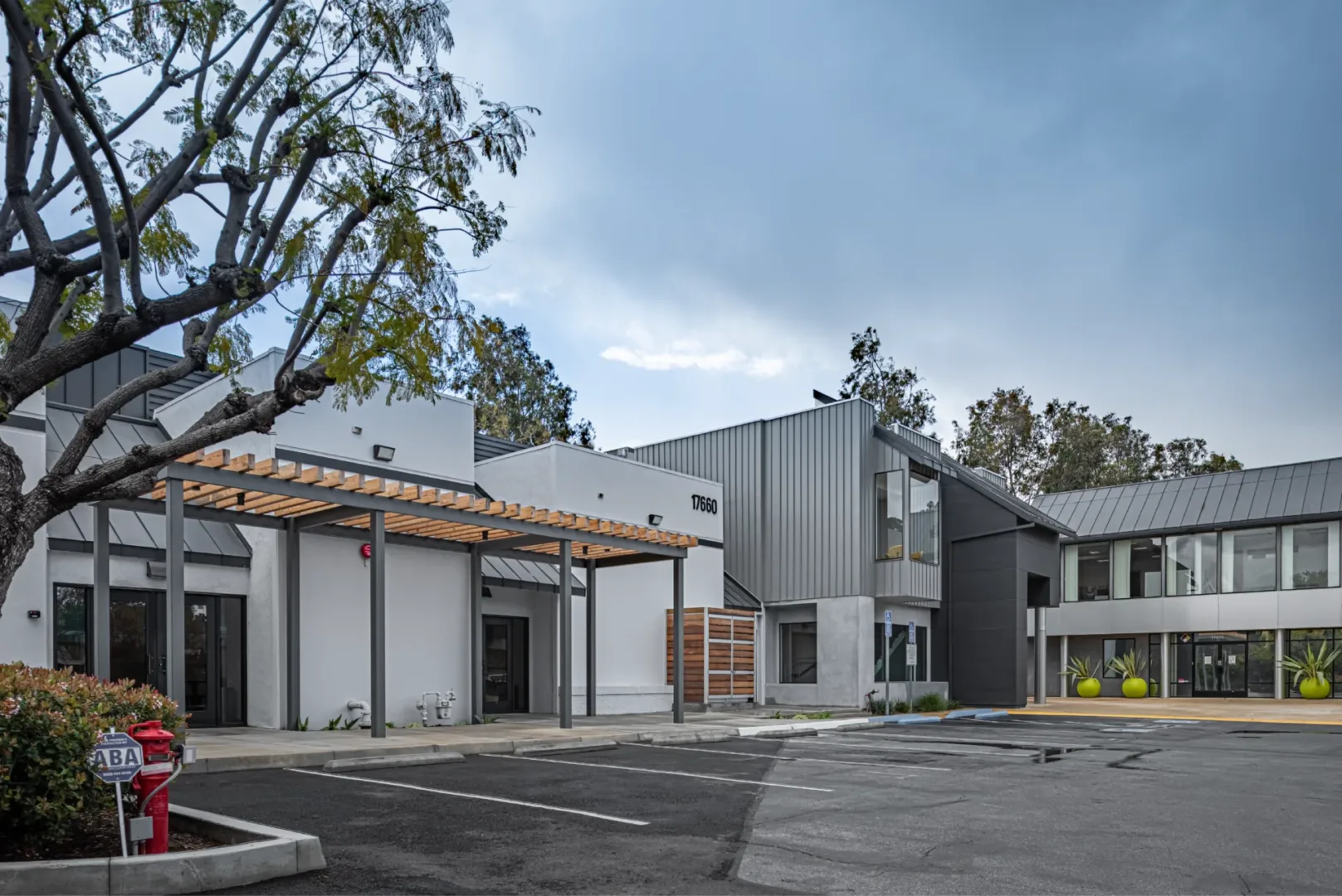 architecture build by visioneering studios highlighting the exterior of mesa church in California that included a new patio with entry trellis. The work also included seismic retrofit of the building