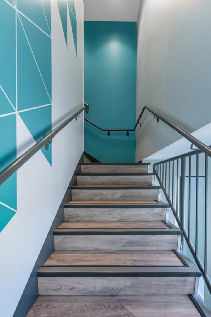mesa church interior staircase highlighter new pain and graphics leading to the student hang out space and classrooms architecture build by visioneering studios