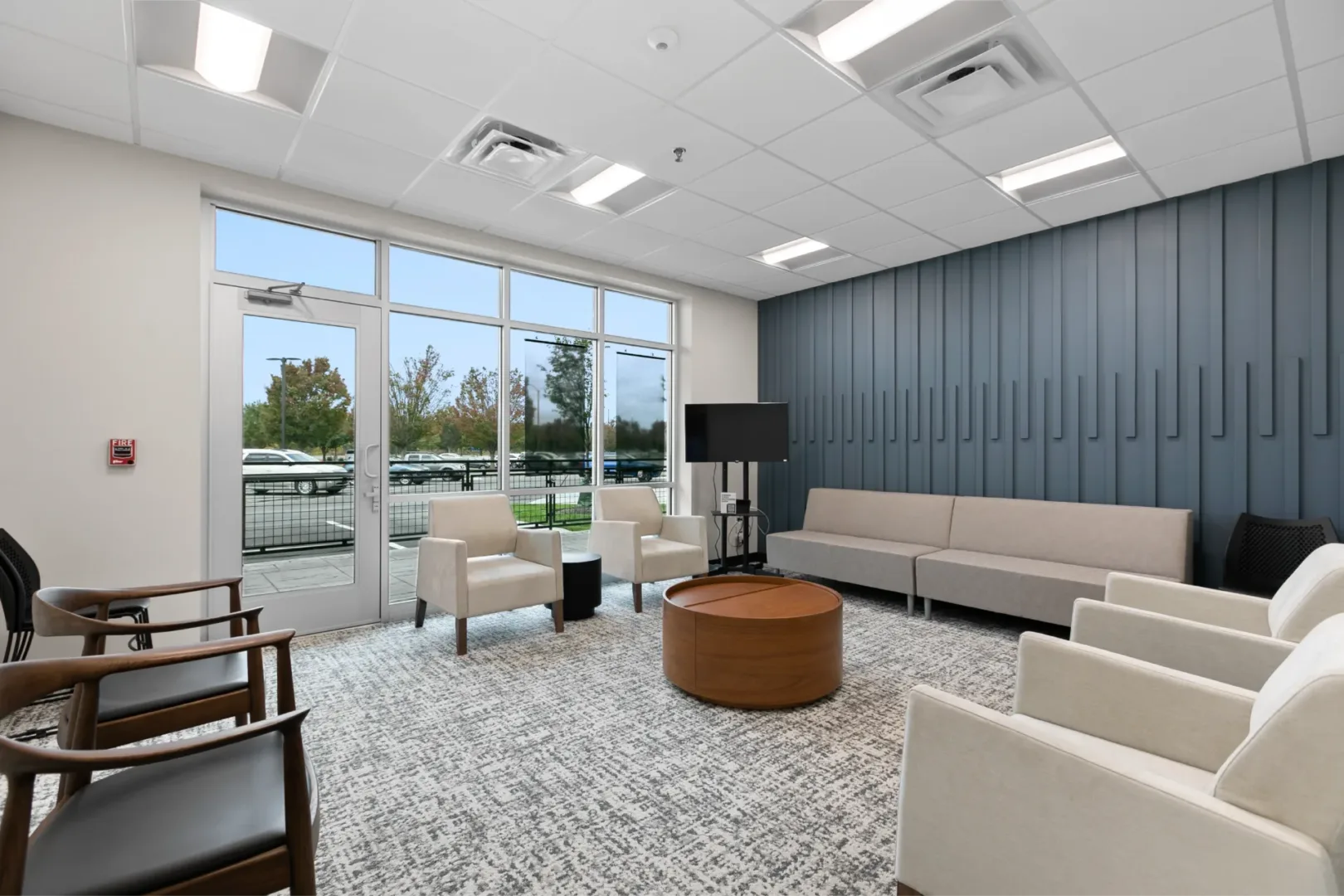 Interior view of a versatile meeting room in the Groups Building at New Vision Baptist Church, church interior design by Visioneering Studios.