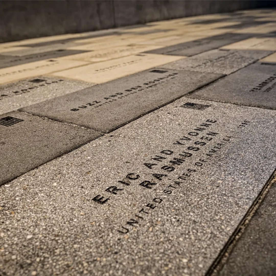 Close-up of engraved paving stones in the East Gate Portal walkway at Shepherd’s Grove, designed & constructed by Visioneering Studios.