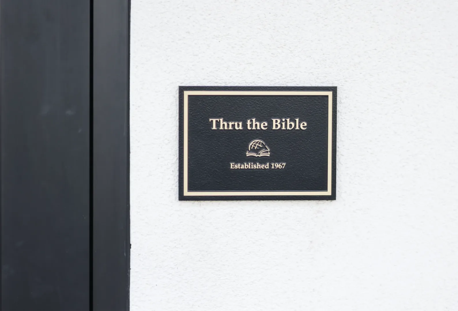 Exterior plaque/signage at Thru the Bible headquarters that reads “Thru the Bible, Est. 1967.”