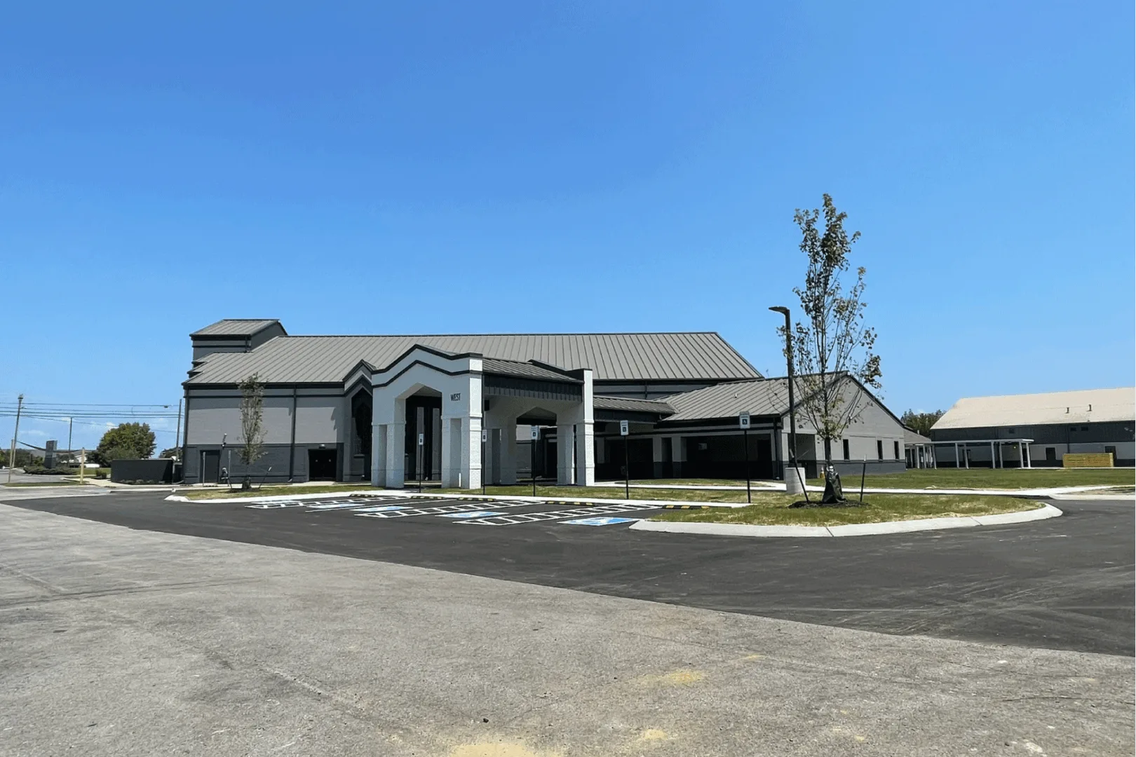 Journey Church campus renovation showing updated exterior façade, new parking layout, and refreshed building design after Visioneering Studios master planning.